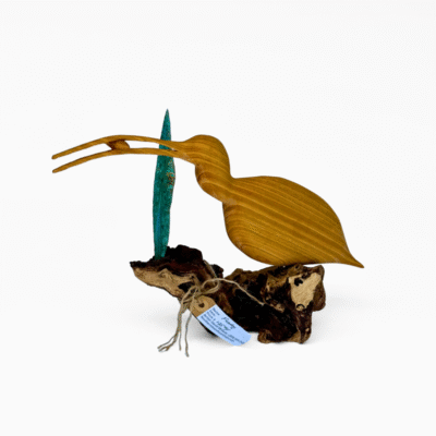 Handcrafted wooden sculpture of a long-beaked bird, like a curlew, on a driftwood base with a teal metallic accent. Unique nature art.
